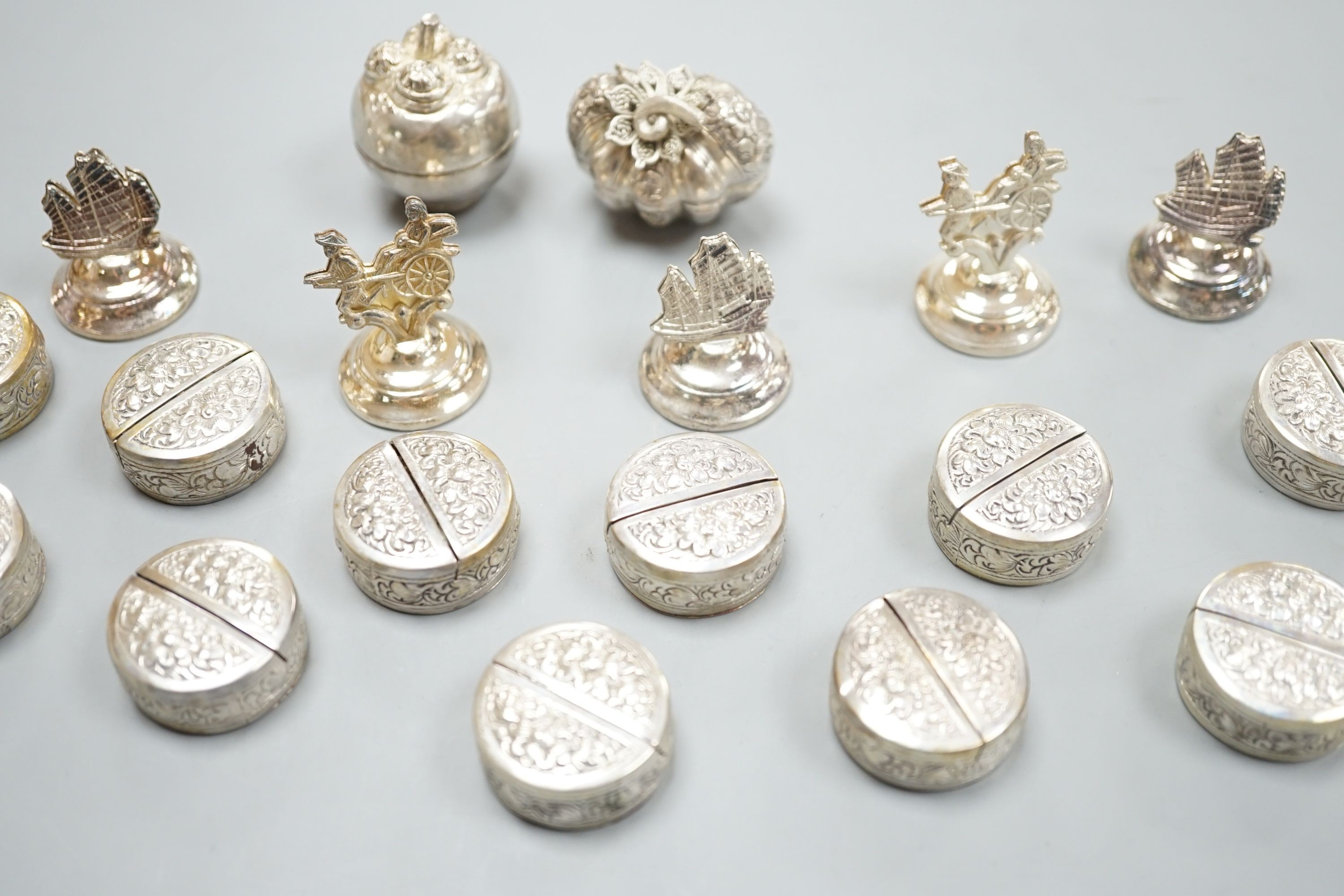 Six Hong Kong sterling menu holders and twelve Cambodian 900 standard white metal place setting holders and two Balinese boxes.